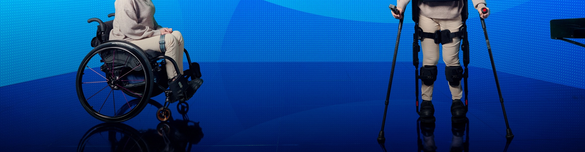 Rear view of a person standing next to a wheelchair while wearing X-ble MEX.