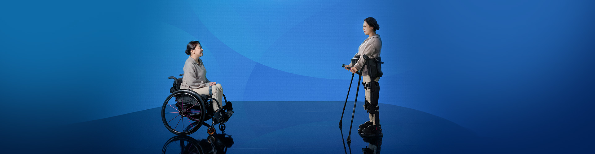 Rear view of a person standing next to a wheelchair while wearing X-ble MEX.