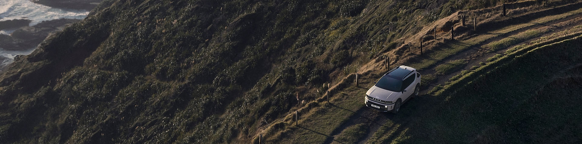 Hyundai NEXO driving along a coastal cliff road