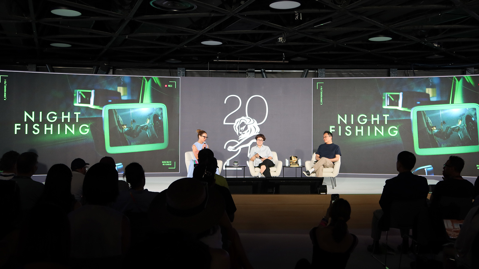 Sungwon Jee and Jung A Kim on stage with moderator