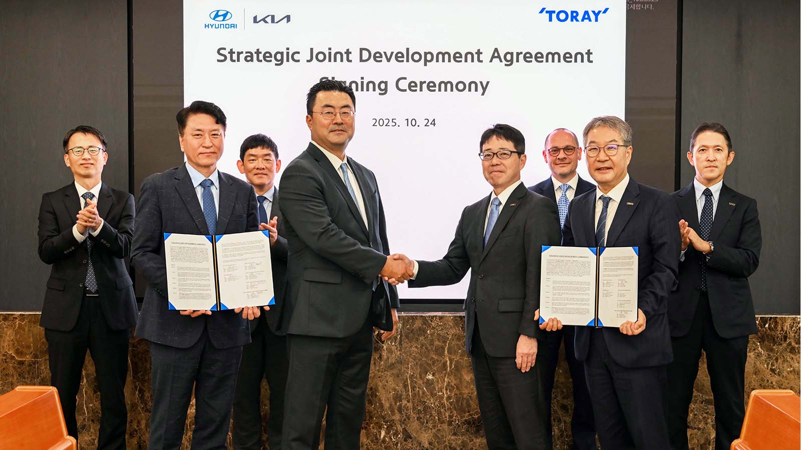 (fourth from left) Heung-soo Kim, Executive Vice President and Head of Global Strategy Office at Hyundai Motor Group; (fifth from left) Miki Terada, General Manager of Advanced Composites Division at Toray Group