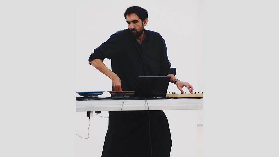 Tarek Atoui performs at the Issey Miyake Spring-Summer 2026 presentation at Centre Pompidou, Paris. October 2025. Photo © Luna Conte.