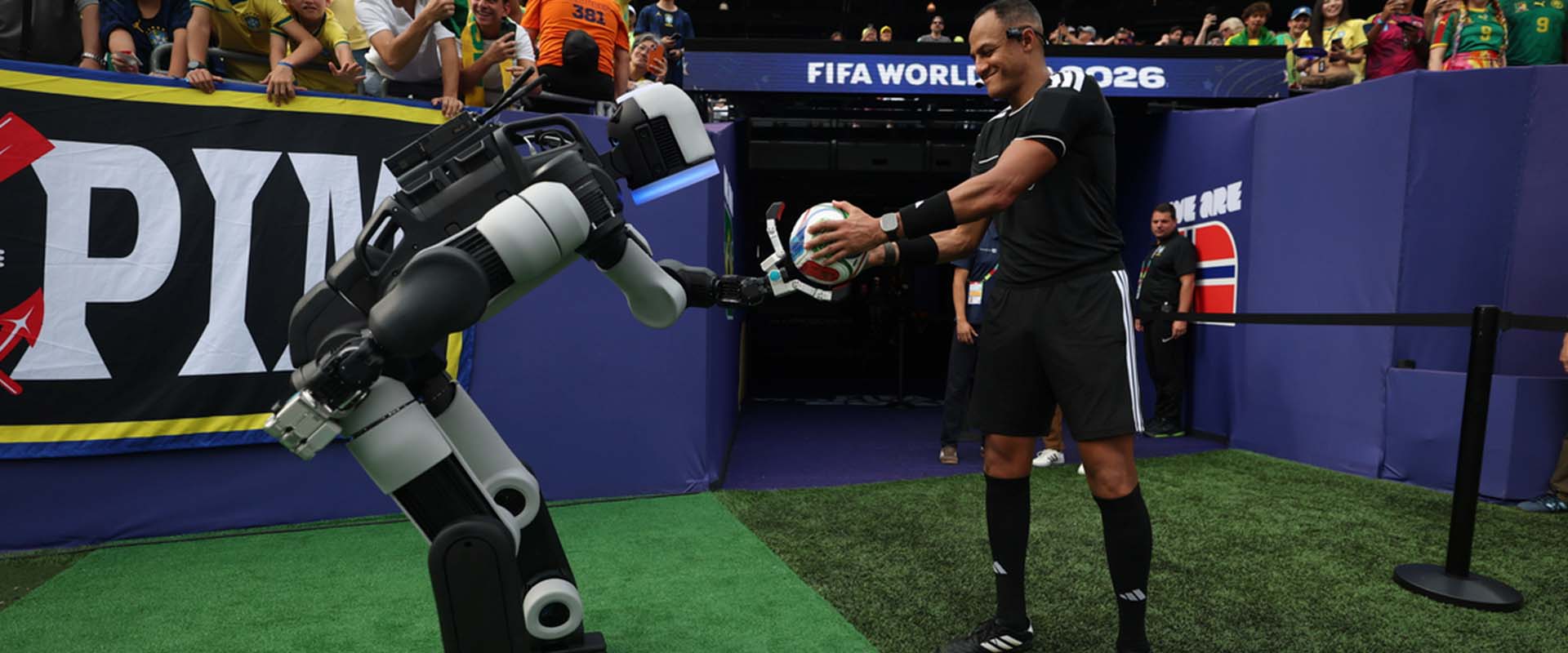 Atlas® delivers the ceremonial match ball to the referee during halftime of a Round of 16 match at New York/New Jersey Stadium at the FIFA World Cup 2026™.
