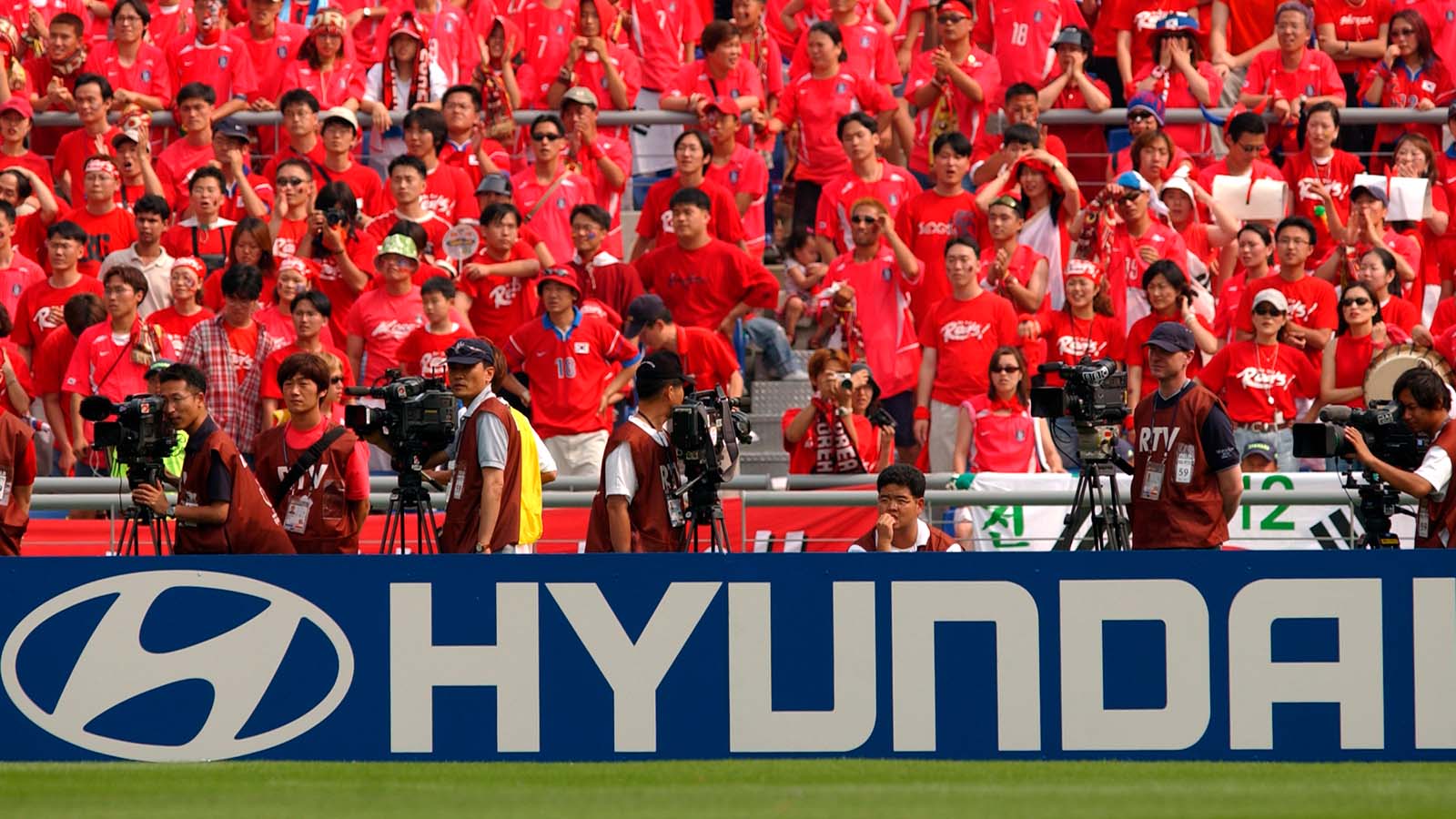 Fans cheer for the Korea Republic national team during the 2002 FIFA World Cup Korea/Japan™.