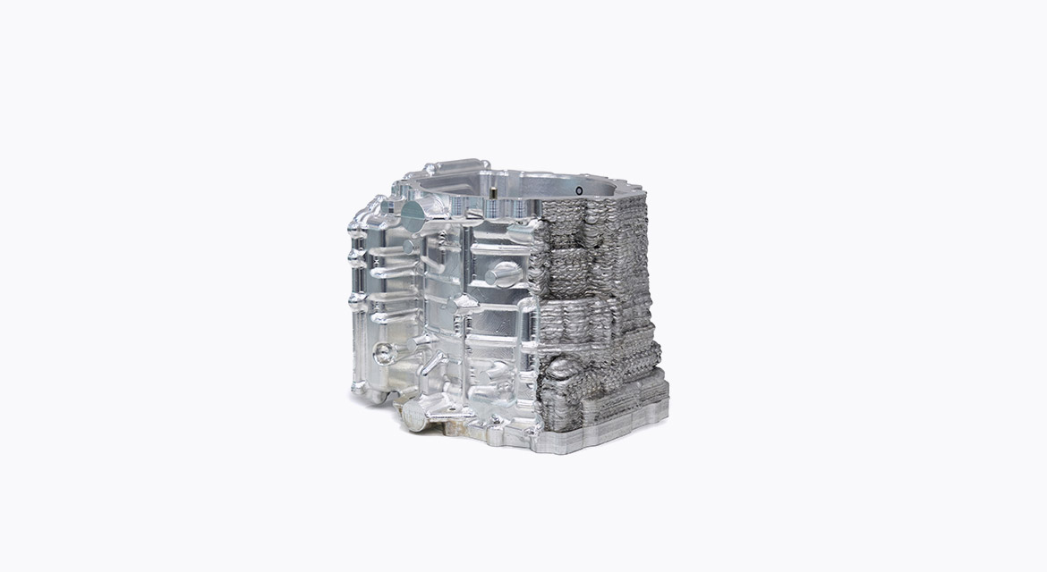 A sample metal component after partial CNC machining, emonstrating post-processing of an additively manufactured part.