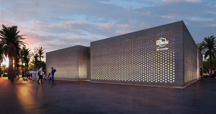 The FIFA Museum building. It is a gray sculptural building made of different block type structures.